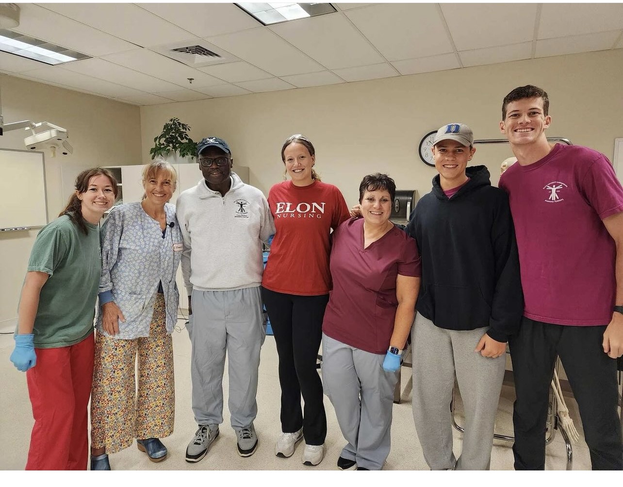 Group of people pose for photo